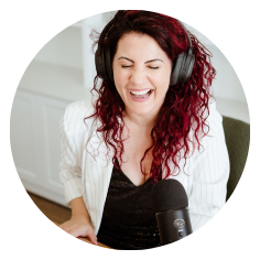 Belle Verdiglione sitting at her desk with headphones on, recording a podcast episode