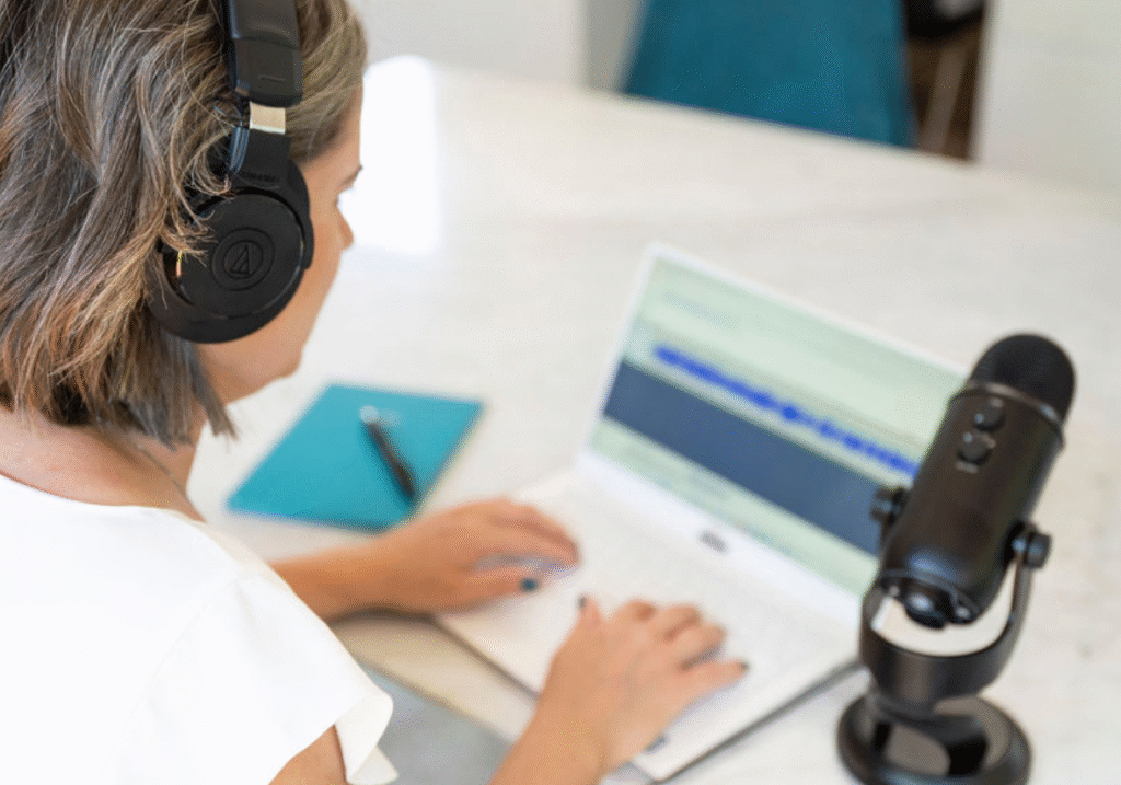 Laura McRae editing a podcast